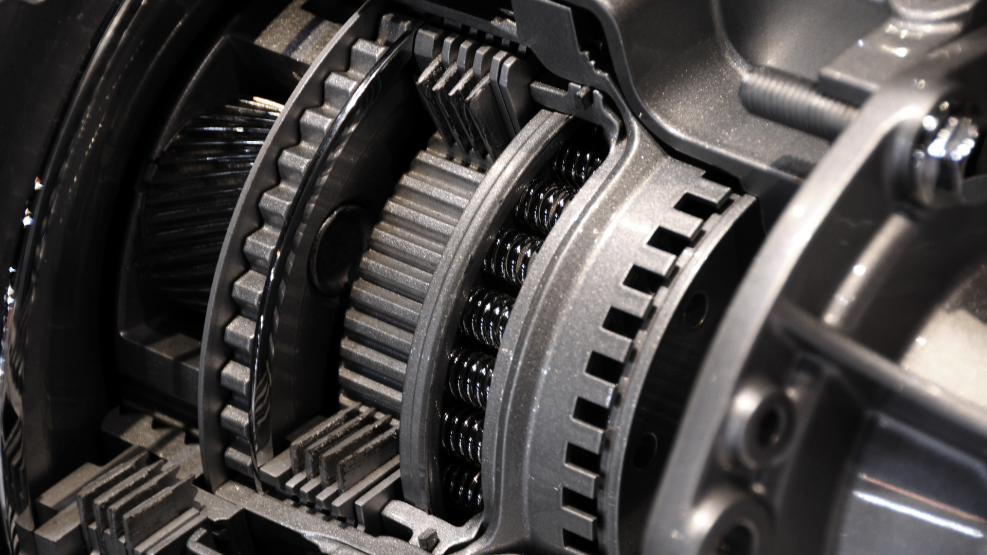 A close up of a gearbox with a lot of gears.