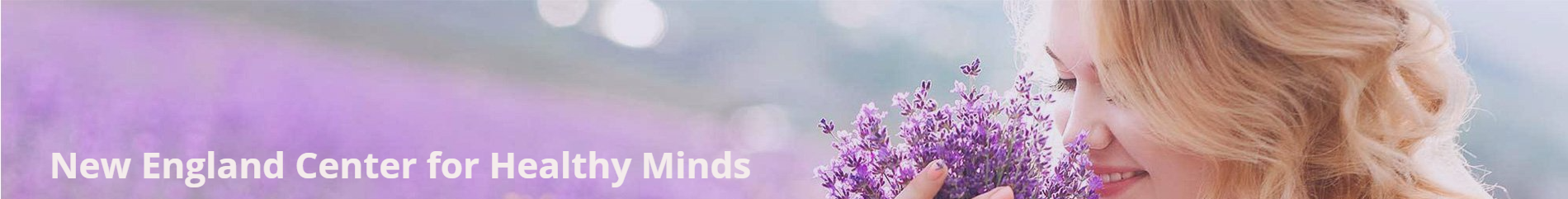 A woman with long hair is holding a bouquet of lavender flowers.