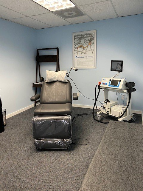 A room with a chair and a machine in it