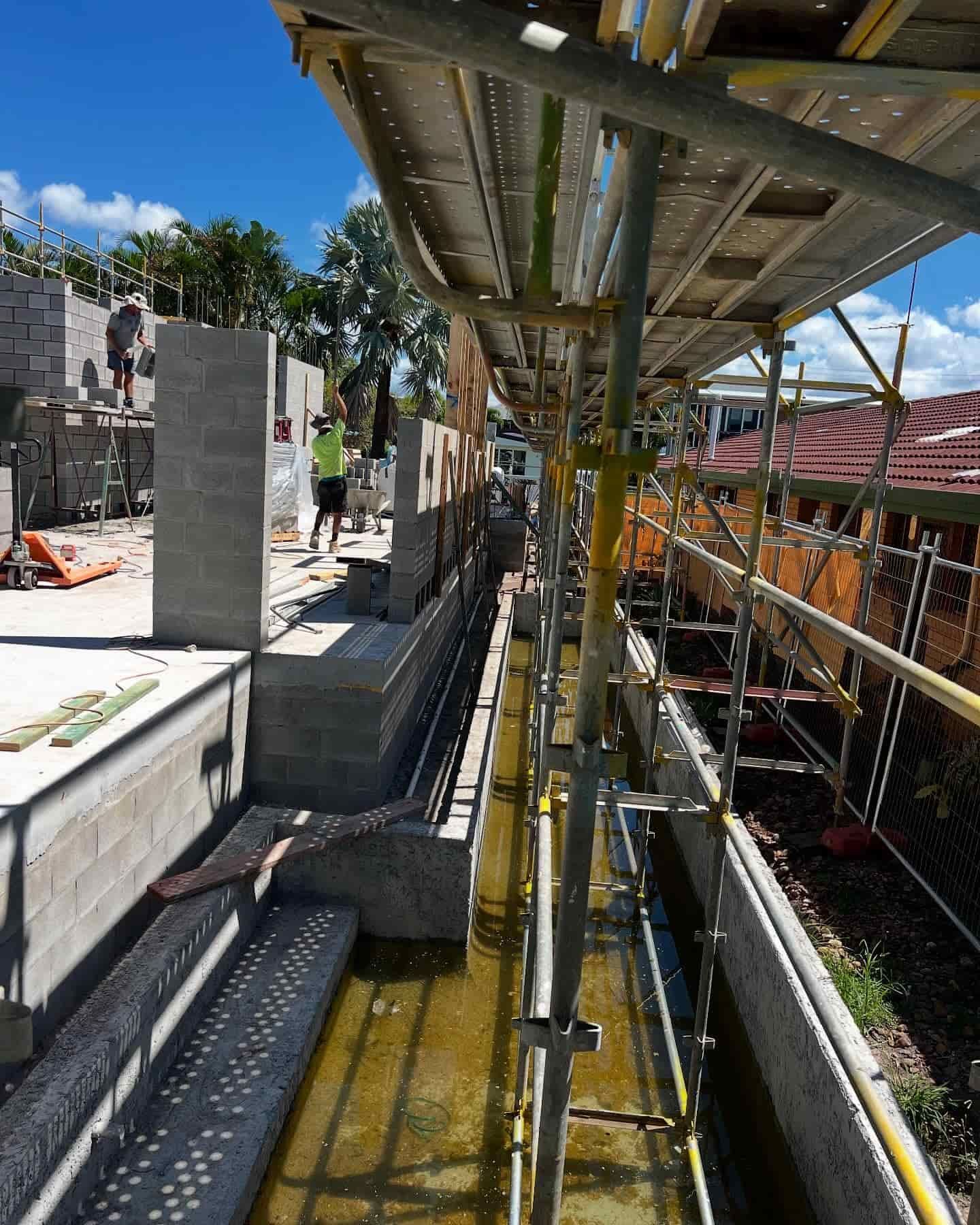 A Construction Site With a Lot of Scaffolding and Stairs — RM Scaffolding Solutions in Pottsville, NSW