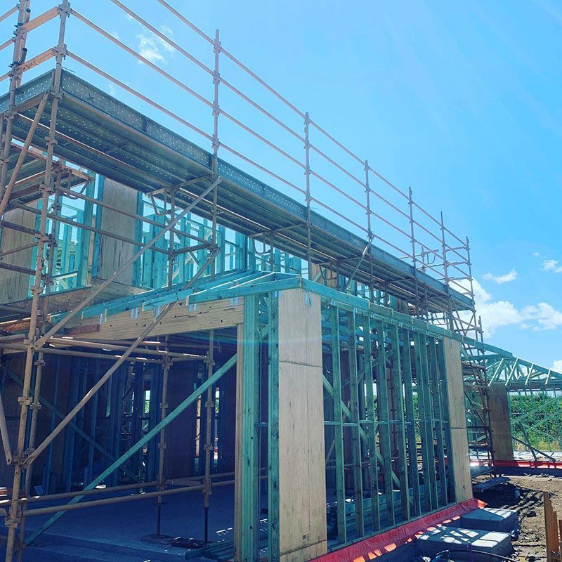 A Building Under Construction With Scaffolding and a Blue Sky in the Background — RM Scaffolding Solutions in Byron Bay, NSW
