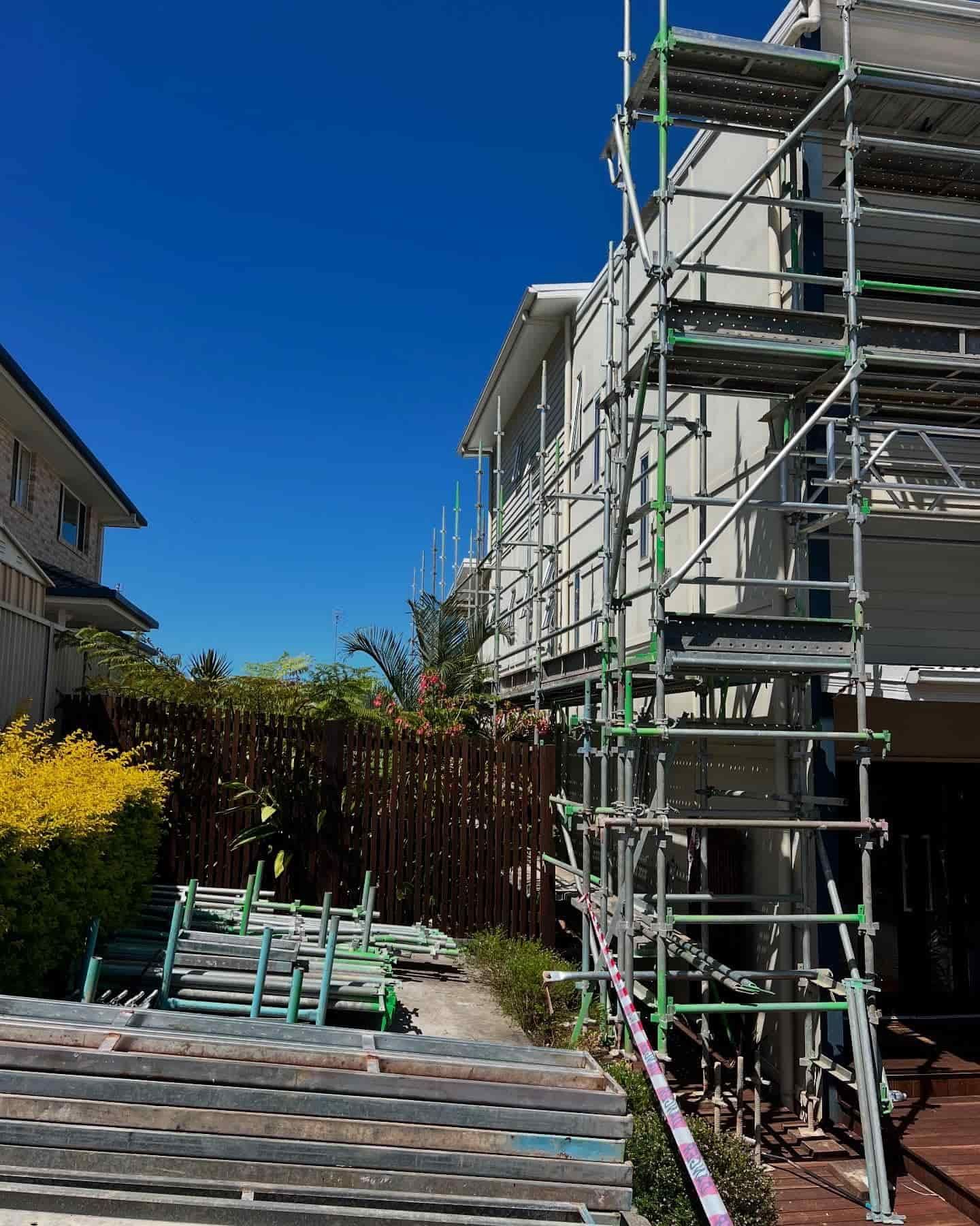 A House is Being Built With Scaffolding Around It — RM Scaffolding Solutions in Banora Point, NSW