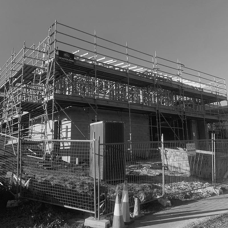A Black and White Photo of a Building Under Construction — RM Scaffolding Solutions in Kingscliff, NSW