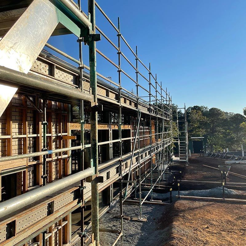 A Row of Scaffolding Along the Side of a Building — RM Scaffolding Solutions in Byron Bay, NSW