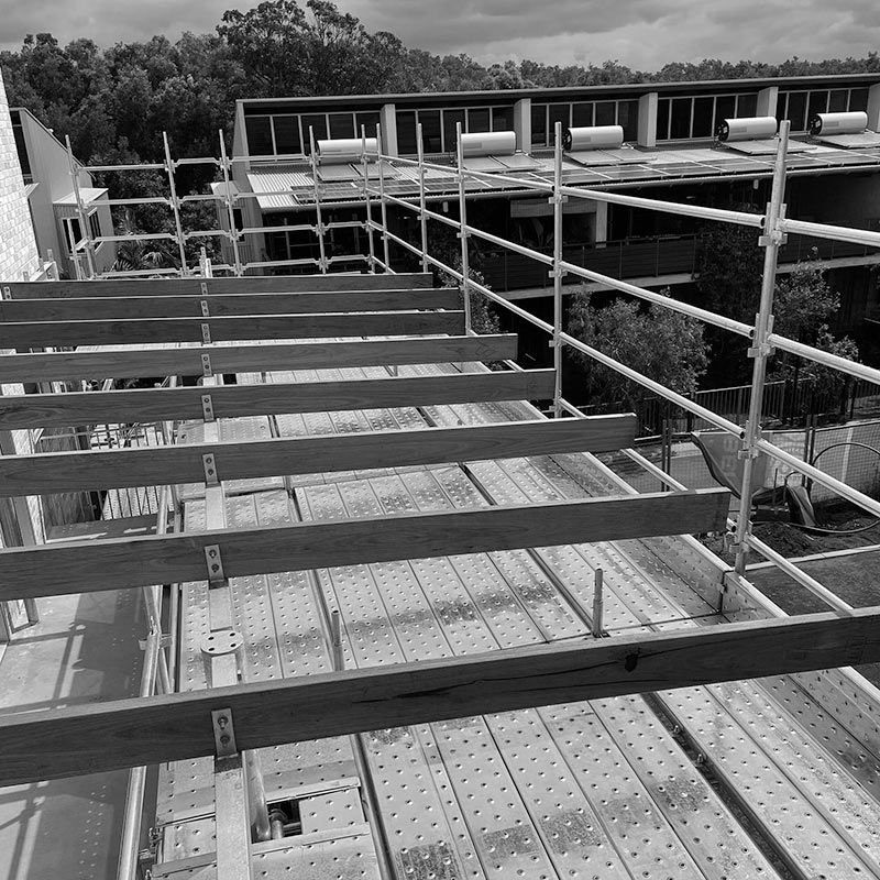 A Black and White Photo of a Building Under Construction — RM Scaffolding Solutions in Lennox Head, NSW