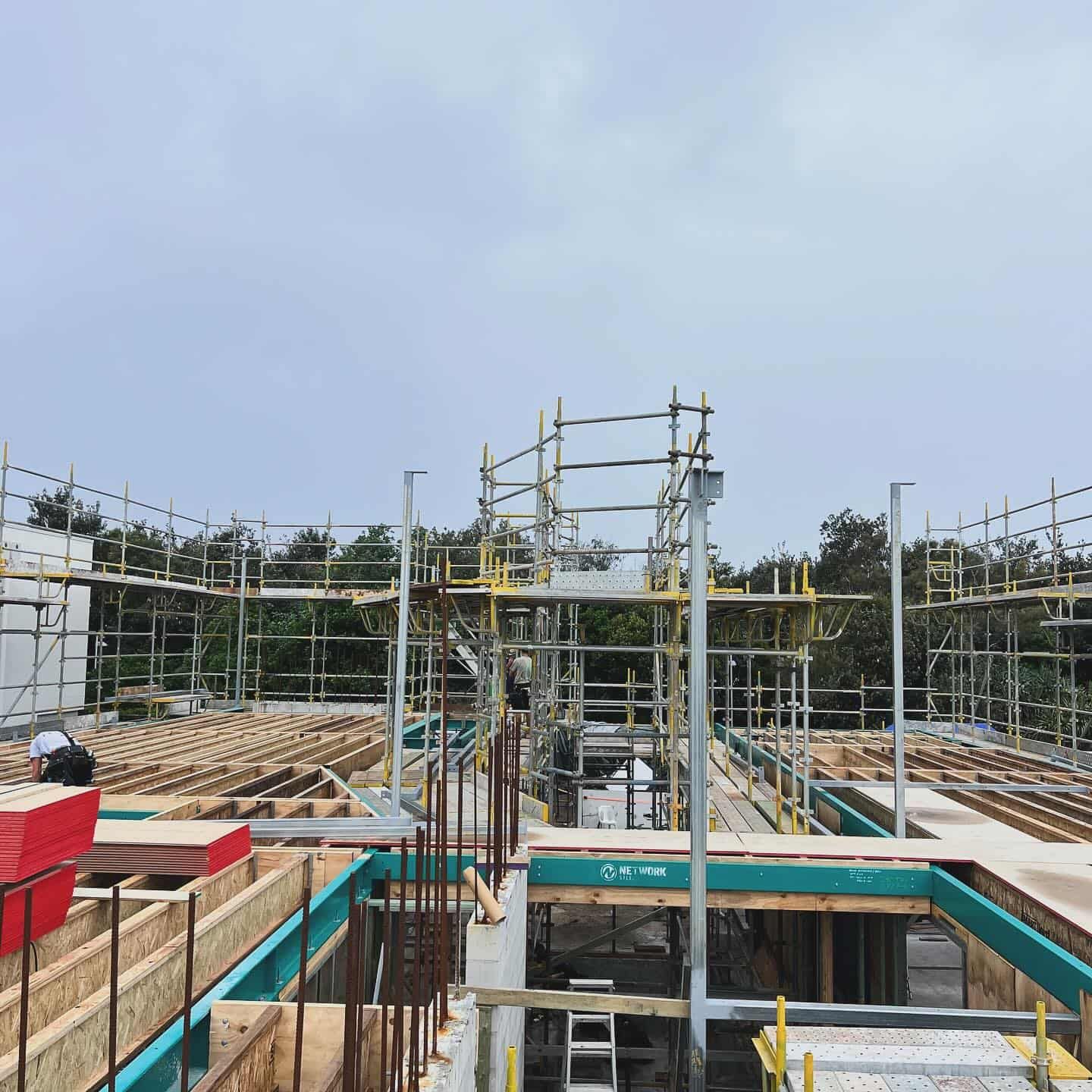A Construction Site With a Lot of Scaffolding on It — RM Scaffolding Solutions in Lennox Head, NSW