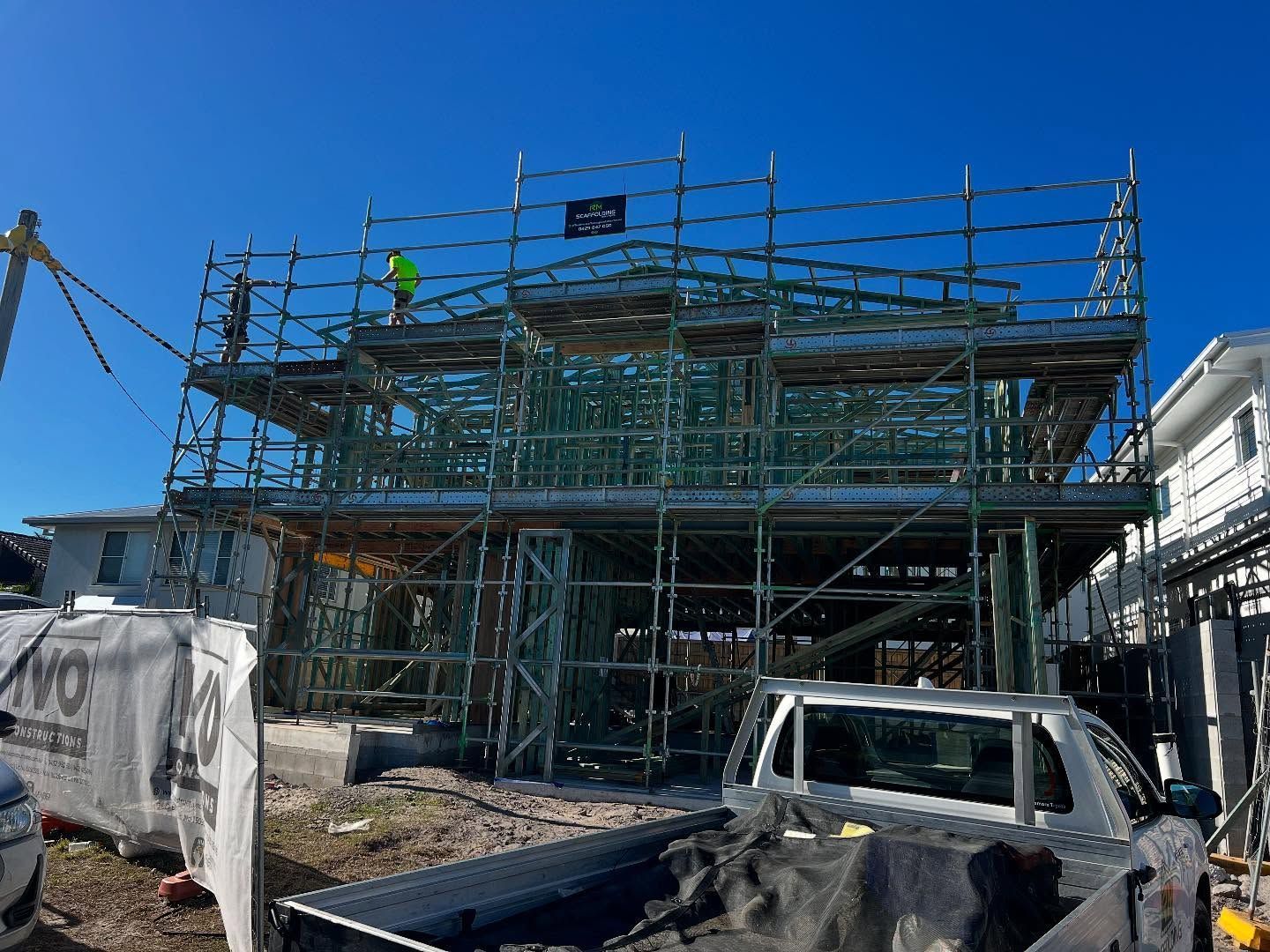 A Truck is Parked in Front of a Building Under Construction — RM Scaffolding Solutions in Lennox Head, NSW