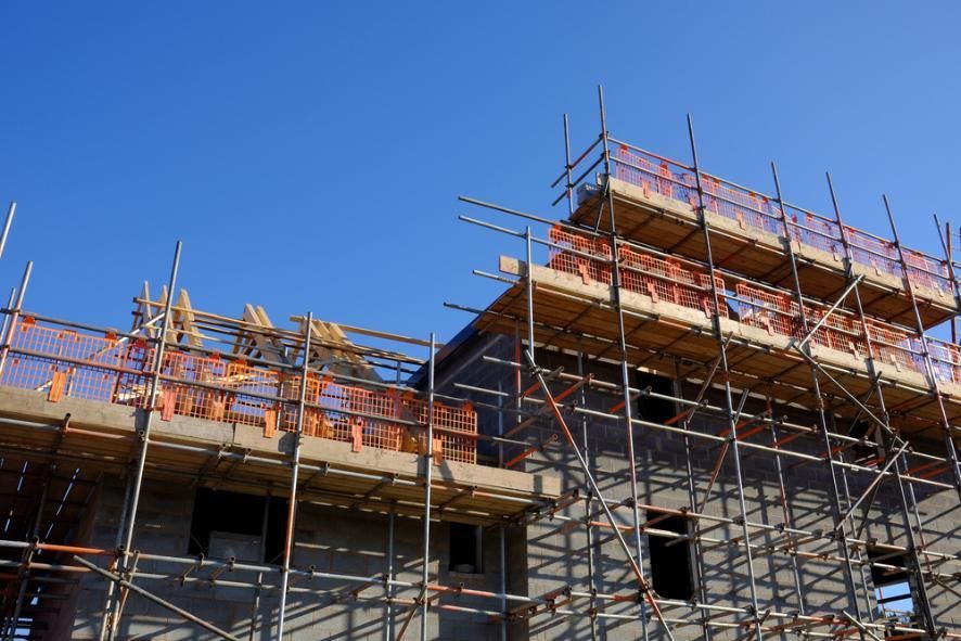 A Building Under Construction With Scaffolding — RM Scaffolding Solutions in Banora Point, NSW