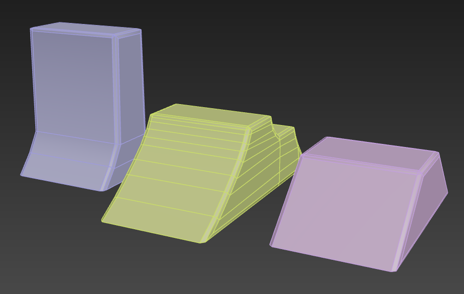 Three different colored blocks are sitting next to each other on a black background.