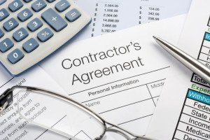 contractors agreement under pen and glasses