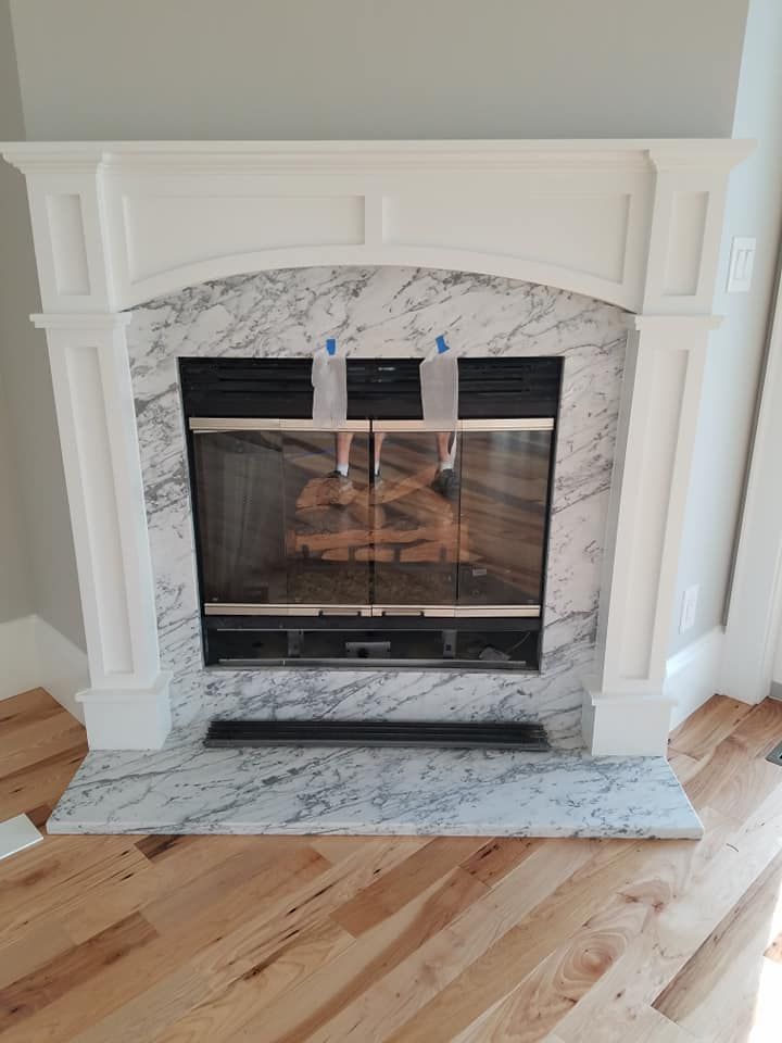 A Fireplace with A Marble Mantle
