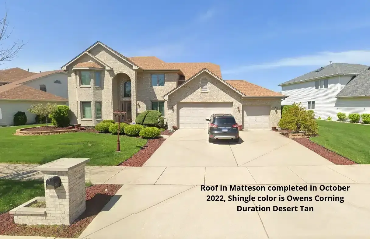 A large house with a car parked in front of it