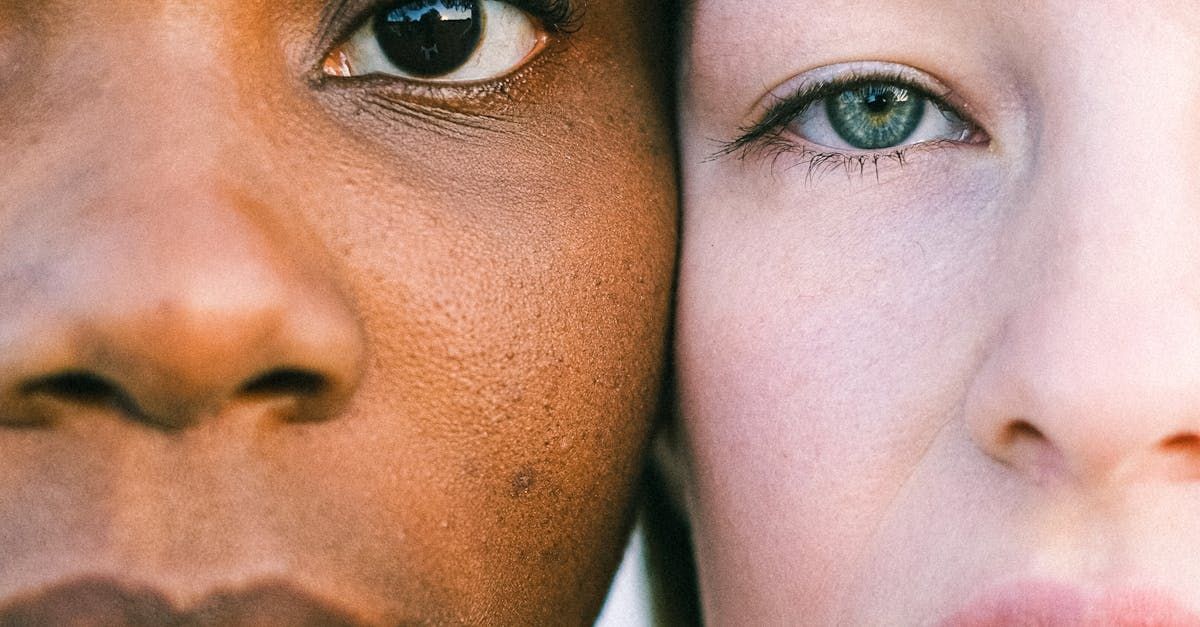 Close-up photo of a women with a beautifully sculpted nose smiling confidently