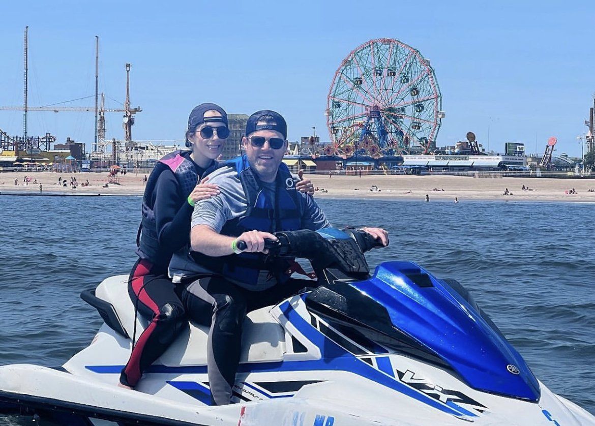 two men on blue and white jet ski in new york