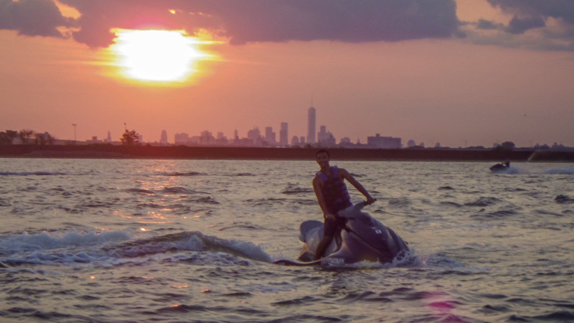 jet ski in the sea at sunset