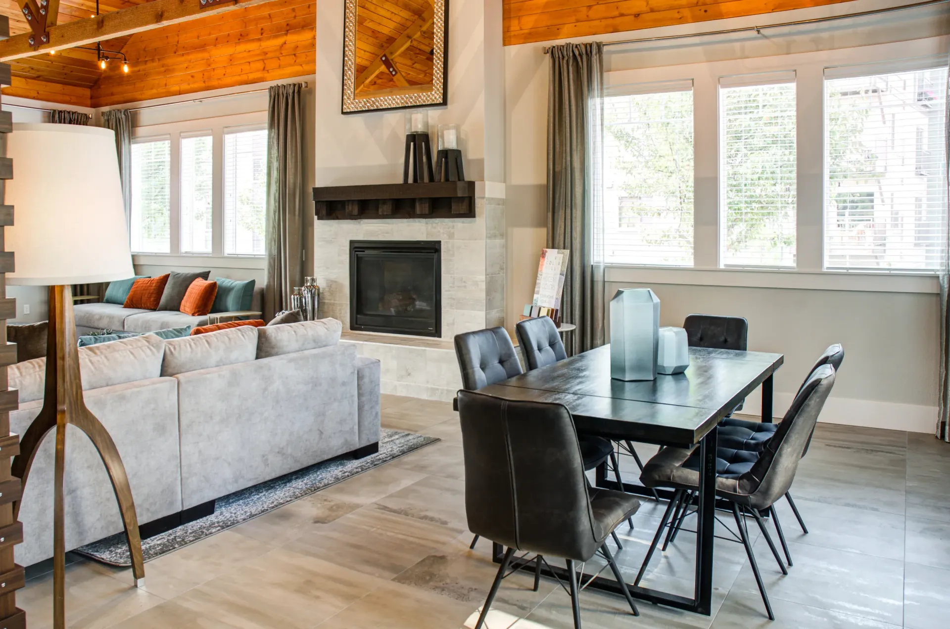 Park with a stone pathway, benches, play area, and houses on a sunny day.