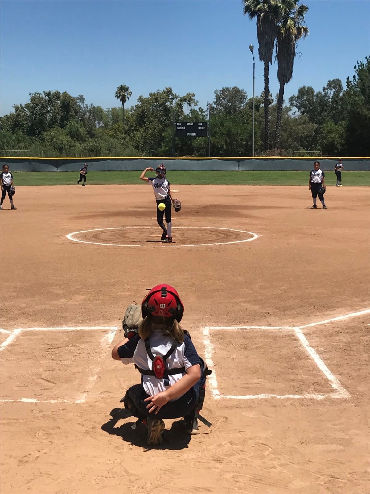 Baseball on a dark surface, with visible stitching.
