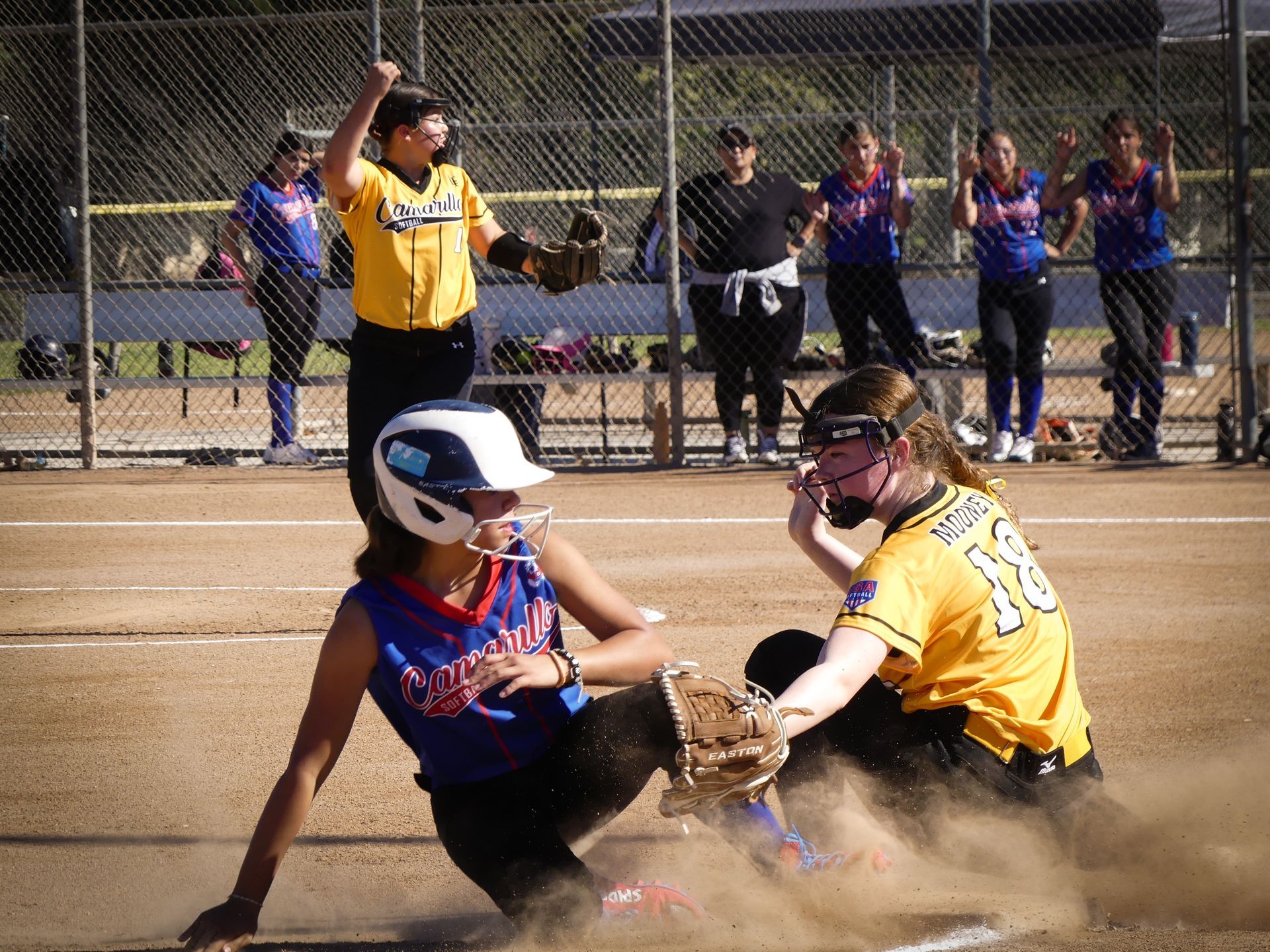 Baseball on a dark surface, with visible stitching.