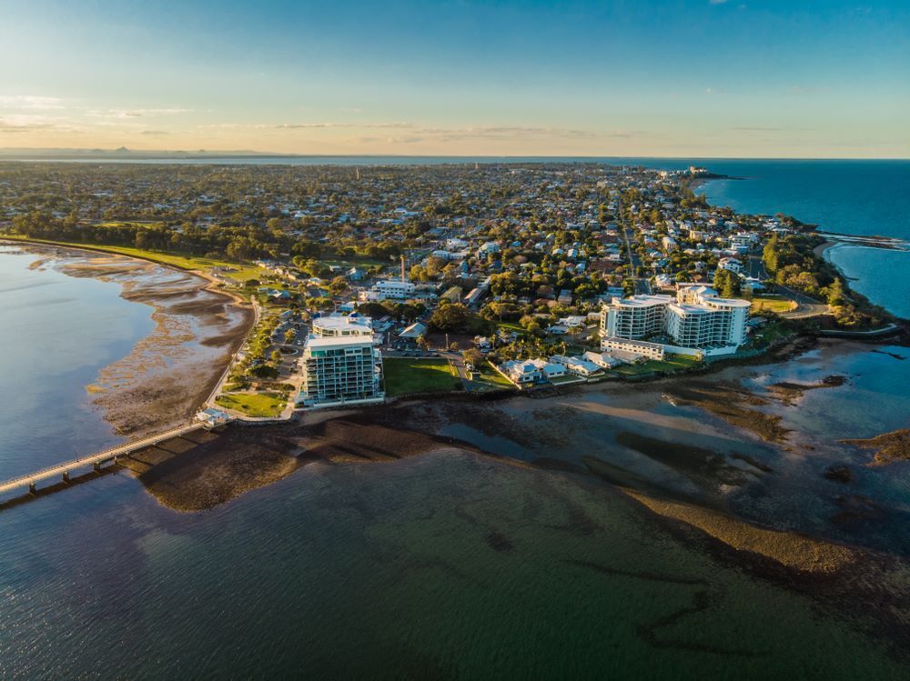 An Aerial View of a City Next to a Body of Water — Top Shelf Glass Pool Fencing & Balustrading in Brisbane, QLD
