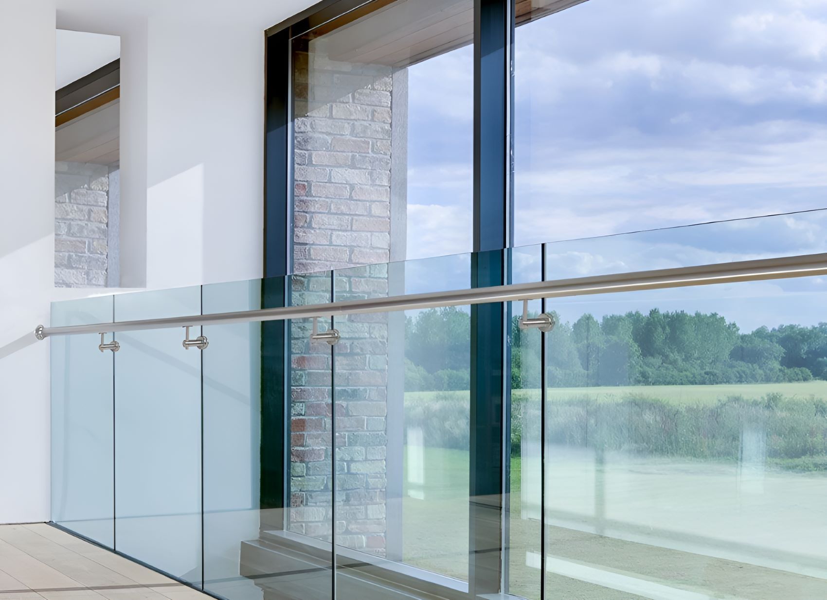A Balcony With a Glass Railing and a Large Window — Top Shelf Glass Pool Fencing & Balustrading in Merrimac, QLD