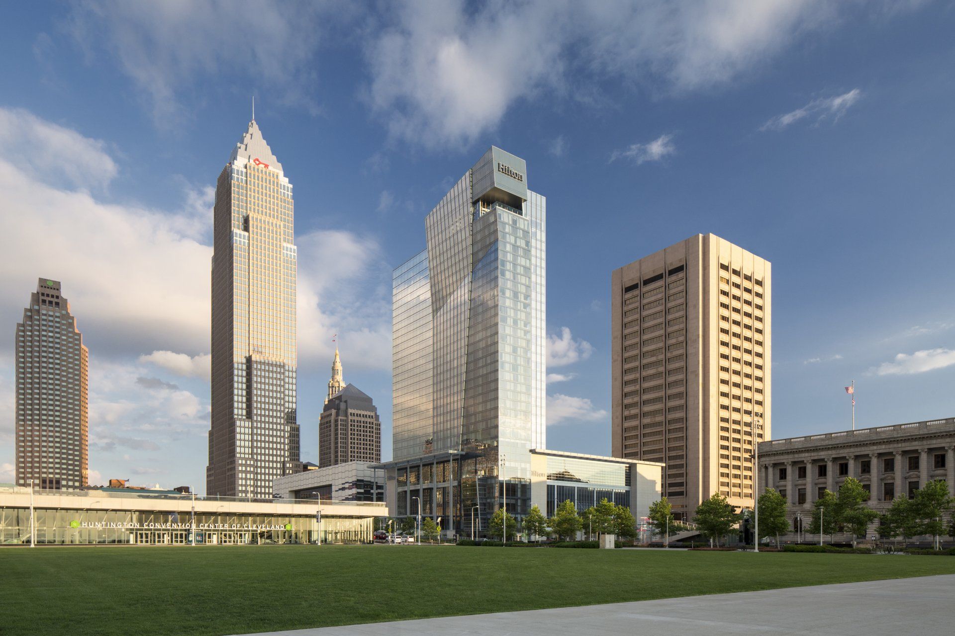 An artist 's impression of a city skyline with a large building in the middle