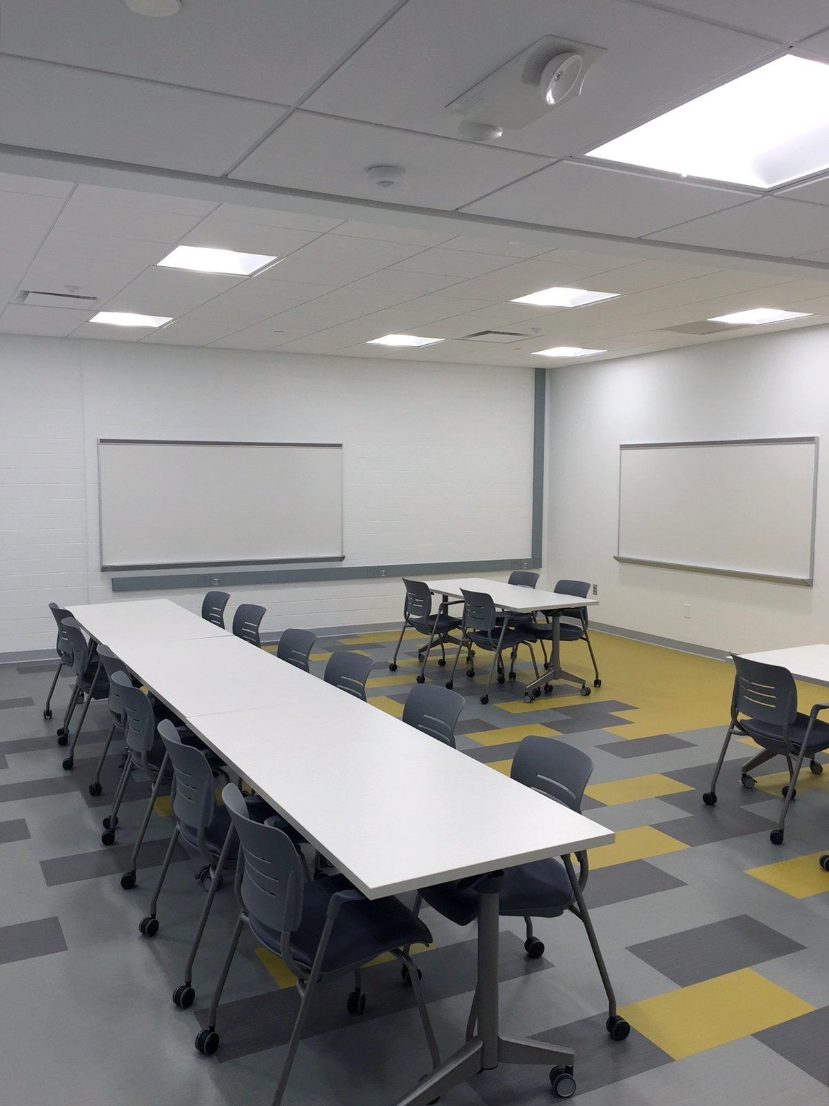 A large room with tables and chairs in it