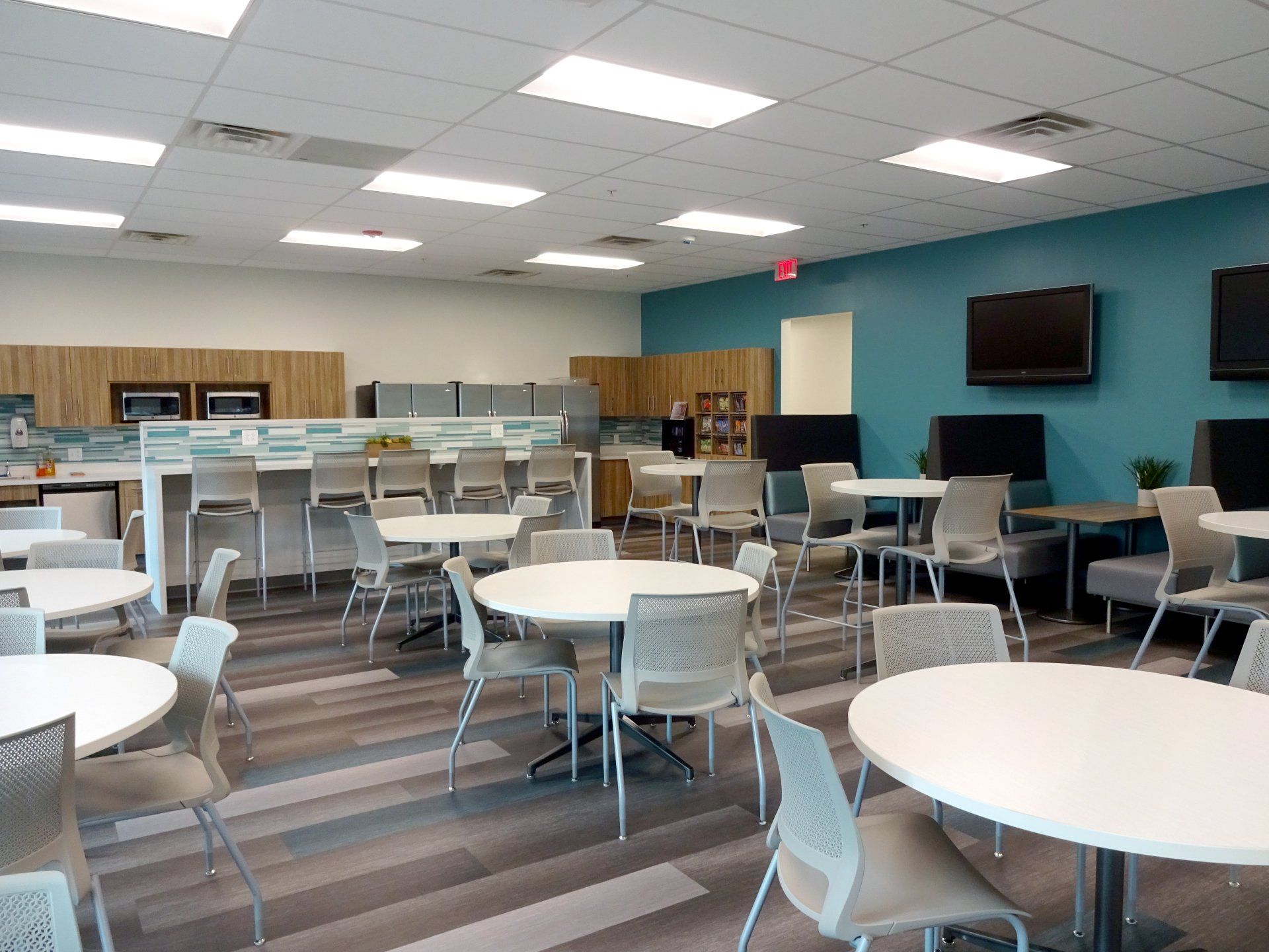 A large room with tables and chairs in it