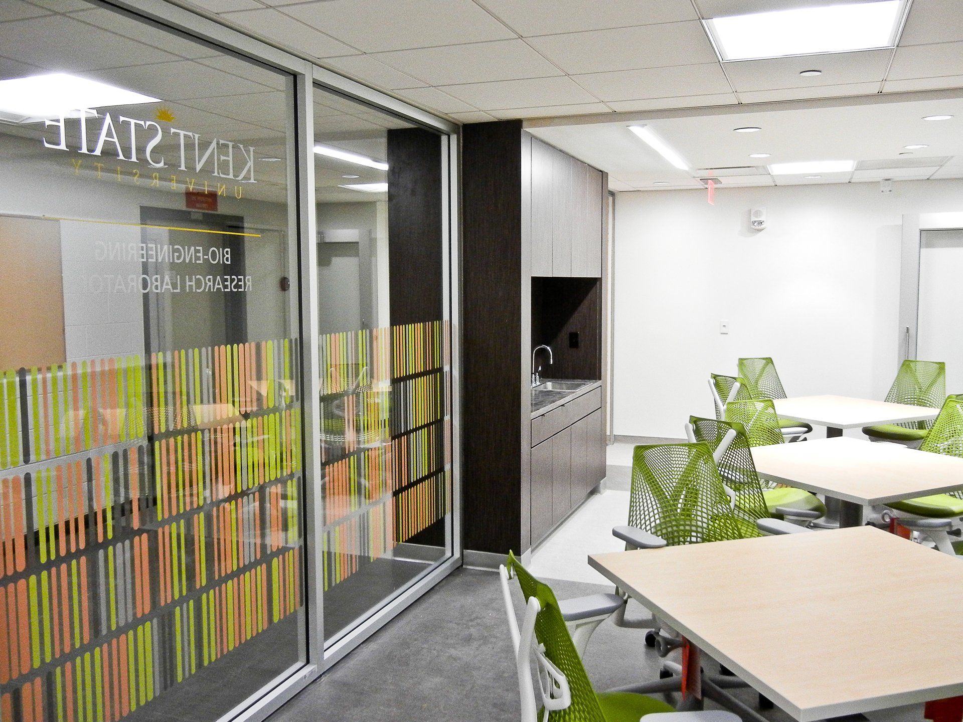 A room with tables and chairs and a sign that says ' a ' on it