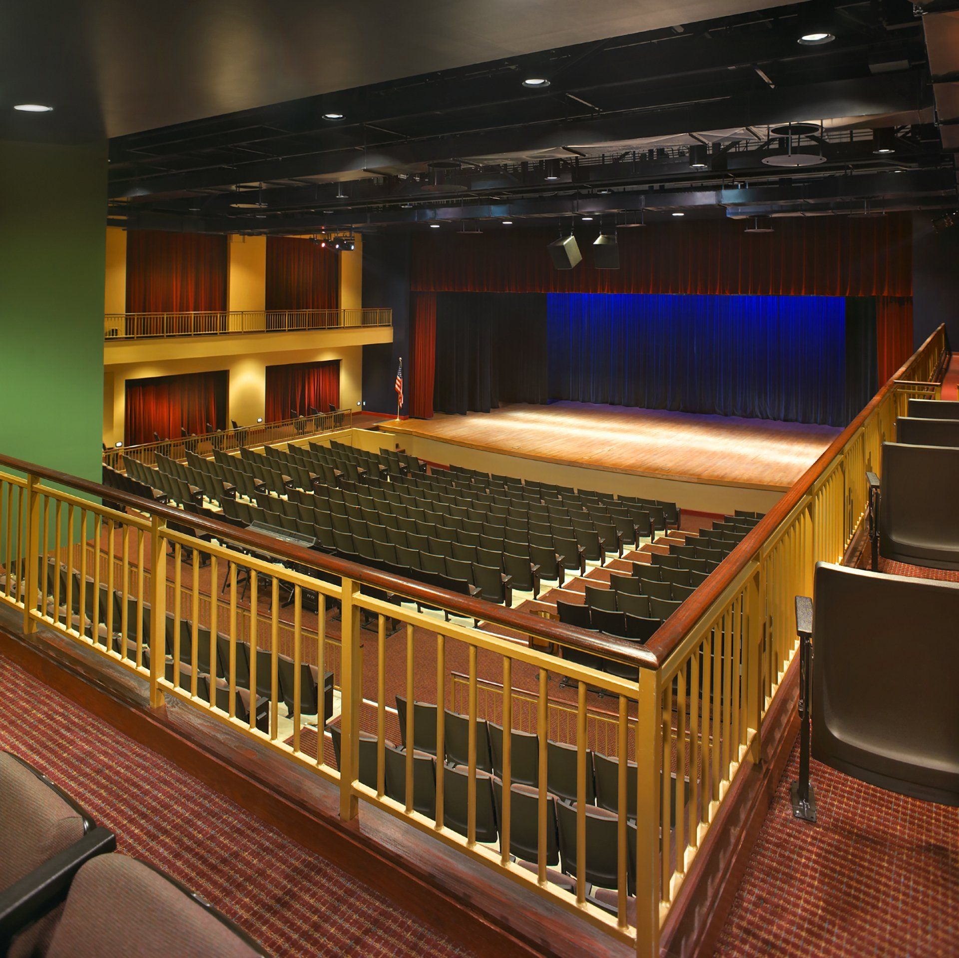 A large auditorium with rows of seats and a stage