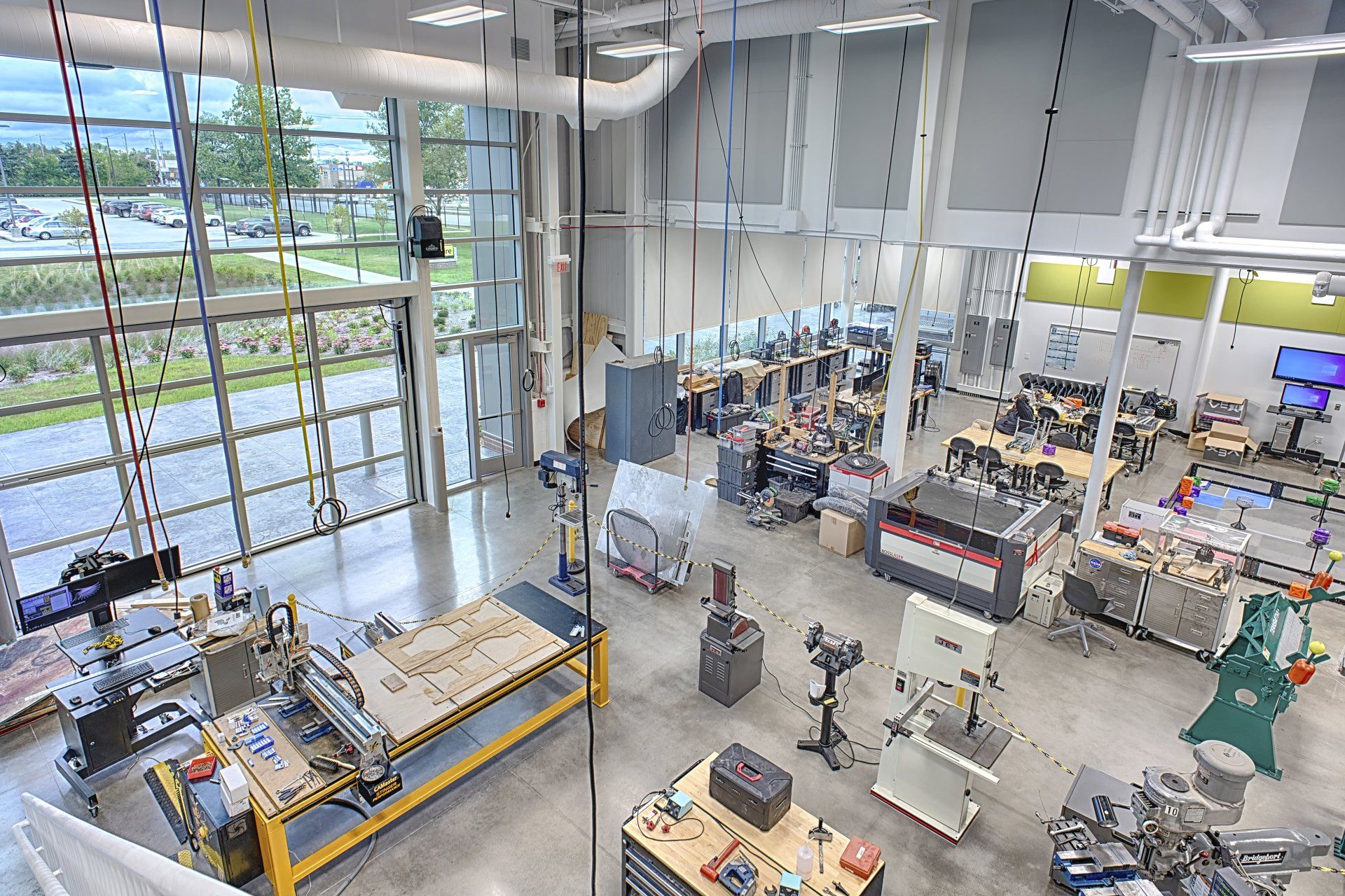 An aerial view of a factory with lots of machinery and tables.