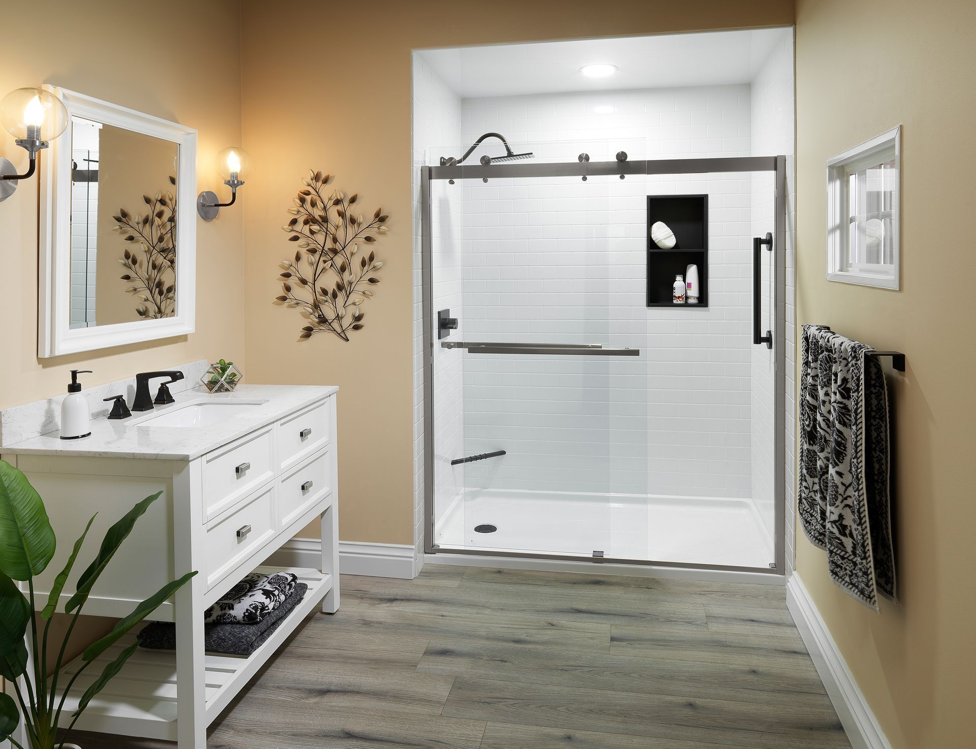 Bathroom with a white vanity, shower with glass doors, and neutral colors.