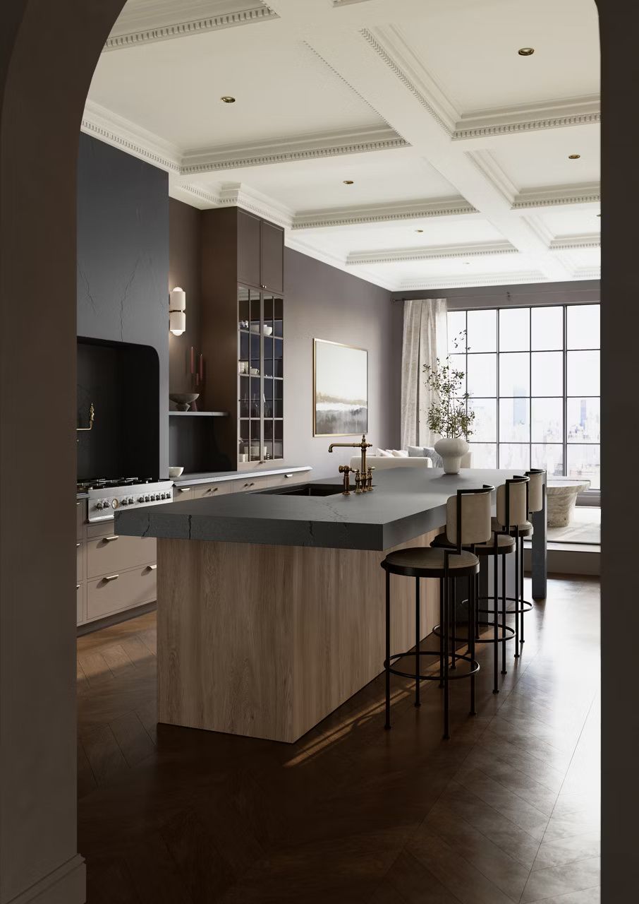 Elegant kitchen with large island, dark cabinets, light wood paneling, and bar stools.