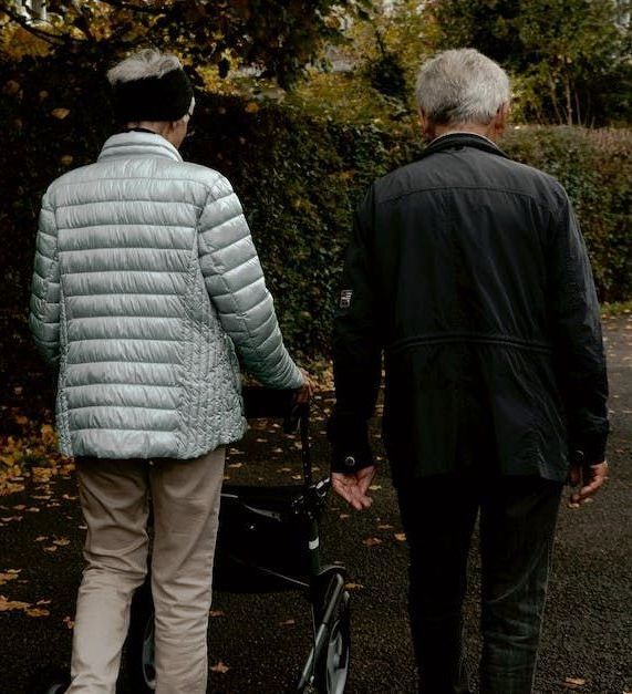 Elderly couple walking together outside