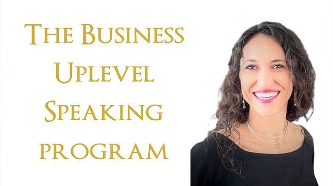 Lila veronica is smiling in front of a sign that says the business uplevel speaking program