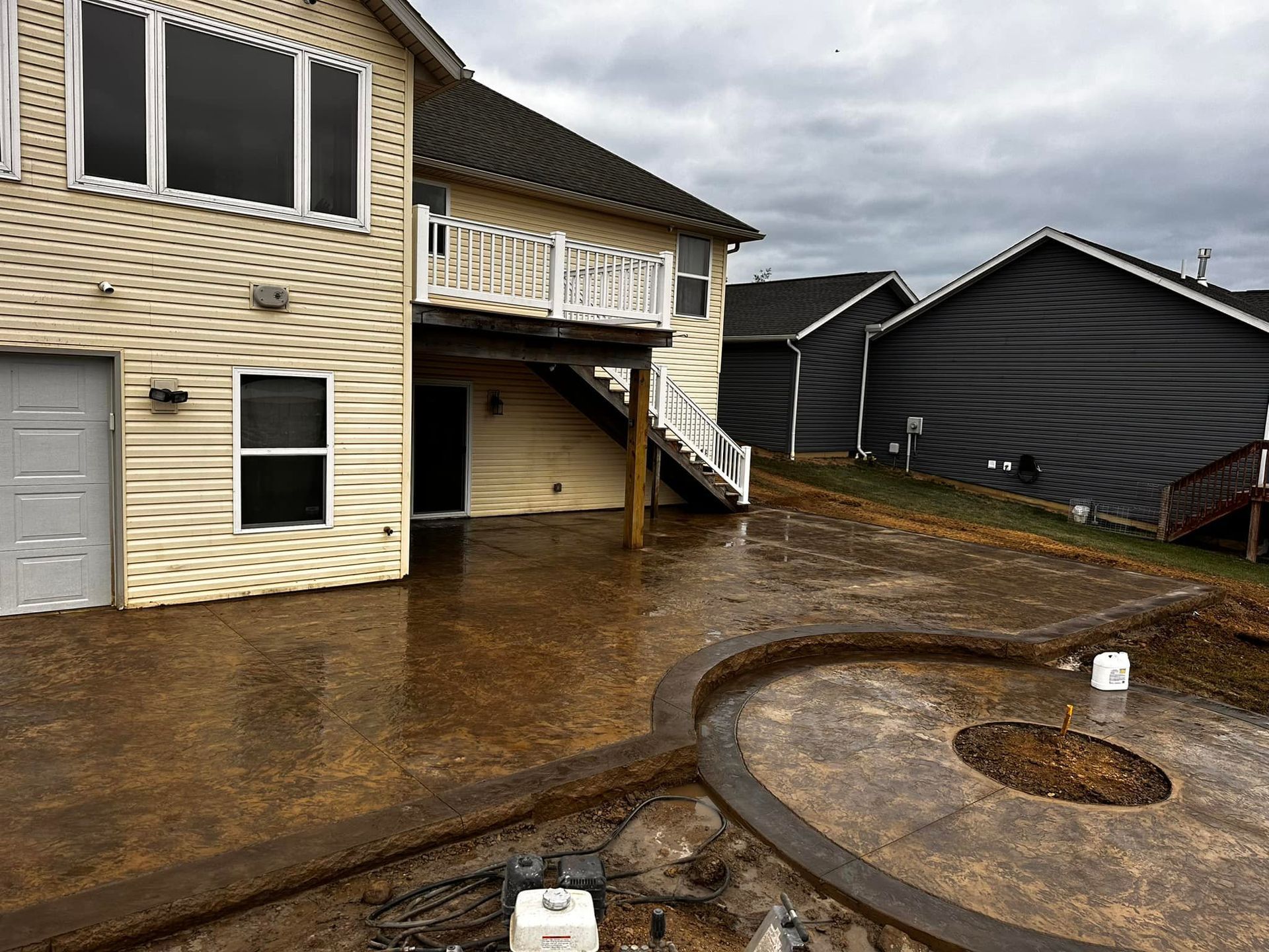 A house with a concrete patio in front of it