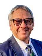 Competition Secretary Graham Robinson
