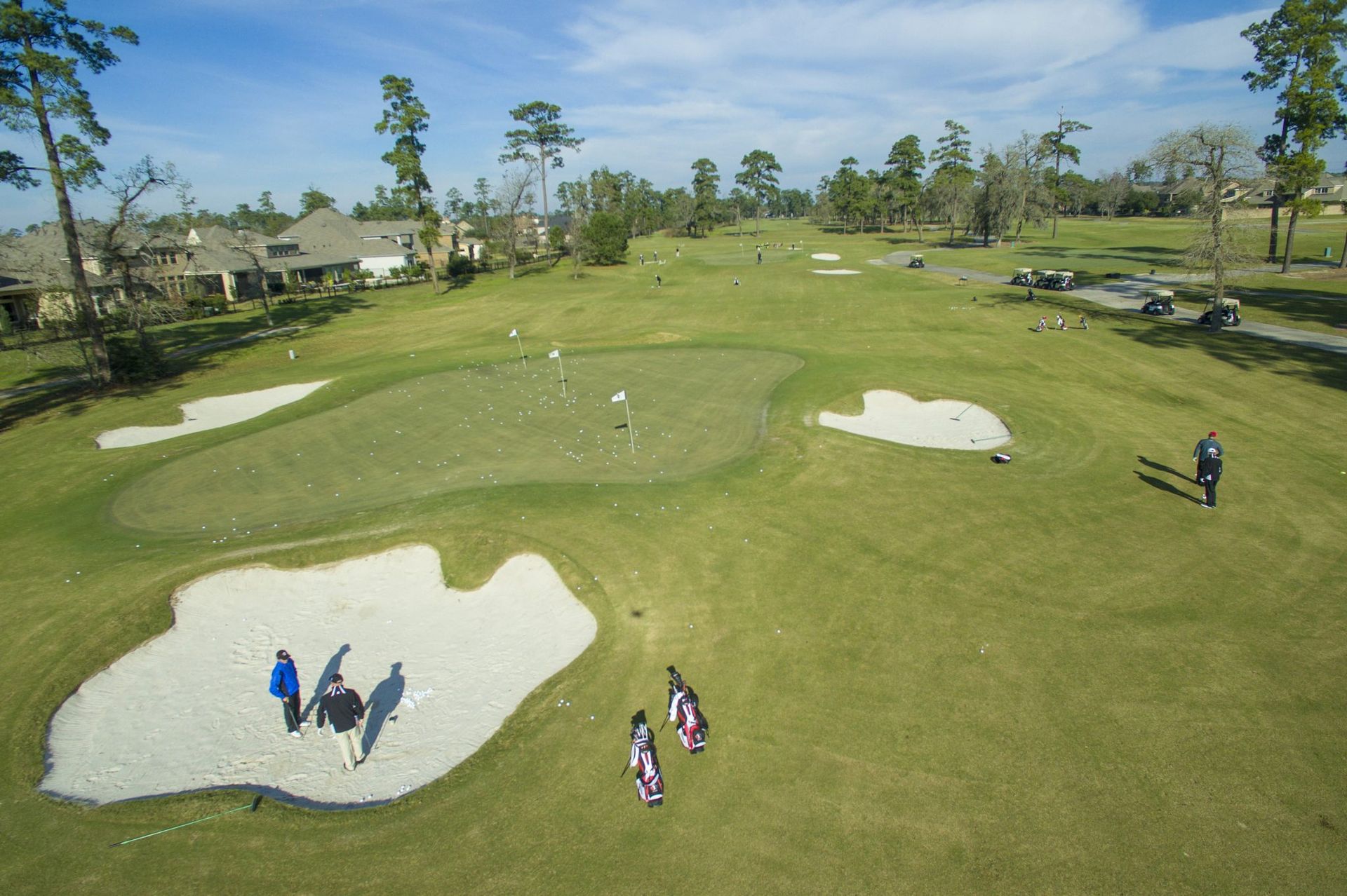 golf course with people on the bunker