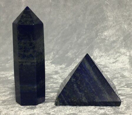 Two Blue Stone Pyramids Are Elegantly Positioned on A Table — Crystal Cauldron In South Mackay, QLD