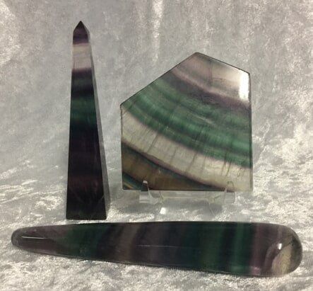Three Pieces of Green and Purple Stone Arranged Together — Crystal Cauldron In South Mackay, QLD