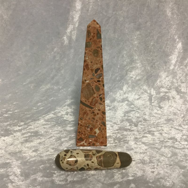 A Stone with A Small Piece of Wood Resting on Its Surface — Crystal Cauldron In South Mackay, QLD