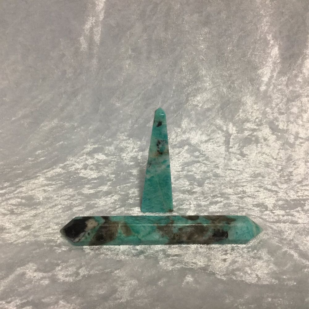 A Green Stone Featuring a Distinct Black Tip — Crystal Cauldron In South Mackay, QLD