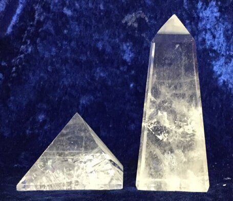 Two Crystal Pyramids Positioned on A Serene Blue Background — Crystal Cauldron In South Mackay, QLD