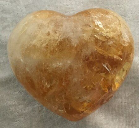 A Heart-Shaped Piece of Yellow Quartz — Crystal Cauldron In South Mackay, QLD