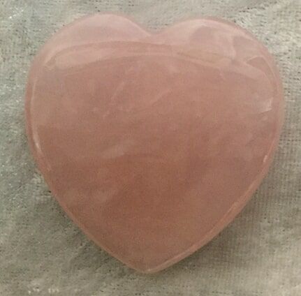 A Heart-Shaped Rose Quartz Crystal, Showcasing Its Soft Pink Hue — Crystal Cauldron In South Mackay, QLD