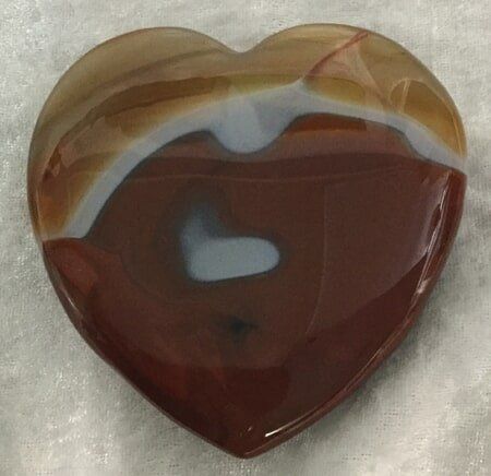 A Heart-Shaped Agate Stone Featuring a Distinctive Brown and White Center — Crystal Cauldron In South Mackay, QLD