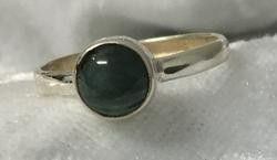 An Elegant Ring Displaying a Striking Green Stone — Crystal Cauldron In South Mackay, QLD