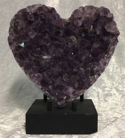 A Beautifully Crafted Amethyst Heart Sculpture Showcasing Intricate Details and Rich Purple Hues — Crystal Cauldron In South Mackay, QLD