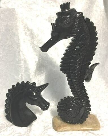 An Artistic Black Statue of A Horse Paired with A Seahorse — Crystal Cauldron In South Mackay, QLD
