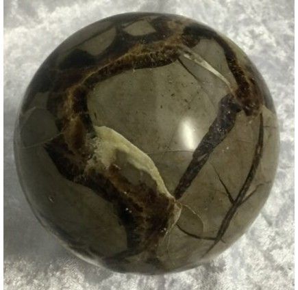 A Polished Spherical Stone With a Glossy Surface — Crystal Cauldron In South Mackay, QLD