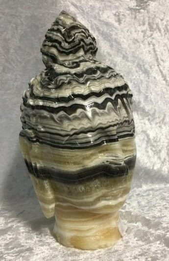 A Black and White Marble Sculpture of A Head — Crystal Cauldron In South Mackay, QLD